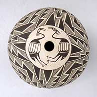 A black-on-white seed pot with a pair of cranes surrounded by a lightning bolt, fine line and geometric design above the shoulder
 by Maurus Chino of Acoma