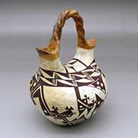 A polychrome wedding vase with a twisted bridge and decorated with a two-panel geometric design
 by Unknown of Acoma