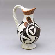 A small polychrome pitcher with a twisted handle and decorated with a geometric design
 by Unknown of Acoma