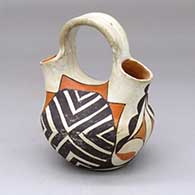 A polychrome wedding vase decorated with a four-panel geometric design
 by Unknown of Acoma