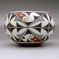 A polychrome jar decorated with a four-panel geometric design, click or tap to see a larger version