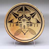 An open black-on-yellow bowl decorated outside with a band of geometric design and inside with a Pahlik Mana design
 by Vernida Polacca of Hopi