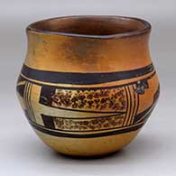 A black-on-yellow jar with a recurved neck and decorated with a four-panel geometric design around the shoulder
 by Unknown of Hopi