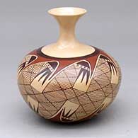 A polychrome seed pot with an extended, recurved neck and decorated around the body with a migration pattern and geometric design
 by Nona Naha of Hopi