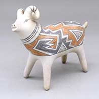 A polychrome bighorn ram figure decorated with a geometric design
 by Michael Kanteena of Laguna