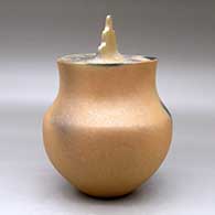 A lidded golden micaceous pot decorated with fire clouds, click or tap to see a larger version