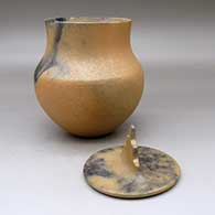 A lidded golden micaceous pot decorated with fire clouds, click or tap to see a larger version