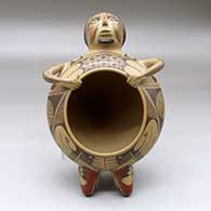 A Ramos polychrome shaman effigy pot decorated with a geometric design
 by Juan Quezada Sr of Mata Ortiz and Casas Grandes