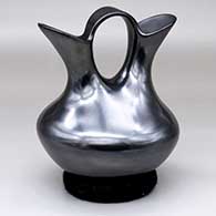 A plain glossy black wedding vase
 by Martin Olivas of Mata Ortiz and Casas Grandes