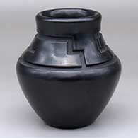 A black jar carved with a geometric design above the shoulder
 by Jeff Roller of Santa Clara