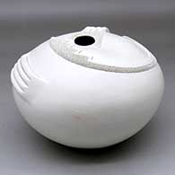 A white seed pot decorated with a corrugated geometric applique and handles
 by Wilfred Garcia of Acoma