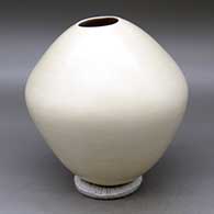 A plain white seed pot with an organic opening
 by Caroline Duwyenie of Hopi