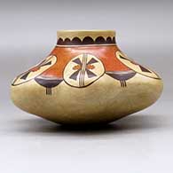 A polychrome melon jar with six repousse ribs and decorated with a geometric design above the shoulder, click or tap to see a larger version