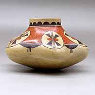 A polychrome melon jar with six repousse ribs and decorated with a geometric design above the shoulder, click or tap to see a larger version