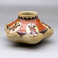 A polychrome melon jar with six repousse ribs and decorated with a geometric design above the shoulder
 by Rachel Sahmie of Hopi