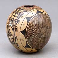 A polychrome seed pot decorated with a four-panel fineline and geometric design
 by Cynthia Sequi of Hopi