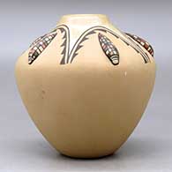 A polychrome jar decorated with five ear-of-corn appliques and a painted  five panel geometric design, click or tap to see a larger version