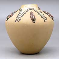 A polychrome jar decorated with five ear-of-corn appliques and a painted  five panel geometric design, click or tap to see a larger version
