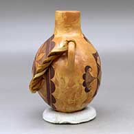 A black on mixed clay canteen with handles and decorated on two sides with a fineline and geometric design, click or tap to see a larger version