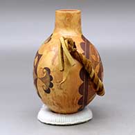 A black on mixed clay canteen with handles and decorated on two sides with a fineline and geometric design, click or tap to see a larger version