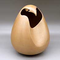 A golden micaceous eagle effigy pot
 by Christine McHorse of Dineh