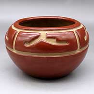 A red bowl carved with a four-panel geometric design above the shoulder
 by Margaret Tafoya of Santa Clara