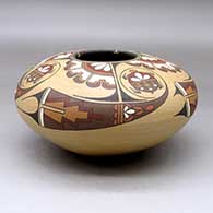 A polychrome seed pot decorated above the shoulder with a four panel turtle and geometric design, Second Prize ribbon 1983 Santa Fe Indian Market, click or tap to see a larger version