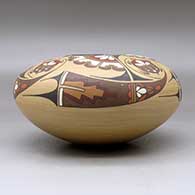 A polychrome seed pot decorated above the shoulder with a four panel turtle and geometric design, Second Prize ribbon 1983 Santa Fe Indian Market, click or tap to see a larger version