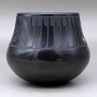 A black on black jar decorated with a band of feathers and geometric design above the shoulder, plus an inlaid stone, click or tap to see a larger version