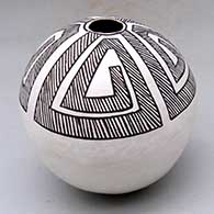 A black-on-white seed pot decorated with a four-panel fine line and geometric design
 by Lucy Lewis of Acoma