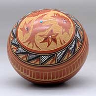 A polychrome seed pot decorated with a sgraffito and painted medallion, hummingbird, flower, and geometric design, with an inlaid stone, click or tap to see a larger version