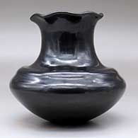 A double-shouldered black jar with a tall neck and pie crust rim, click or tap to see a larger version