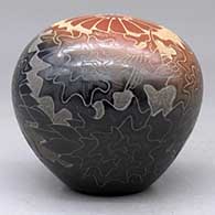 A two-tone seed pot decorated with a sgraffito hummingbird, flower, plants, feathers and geometric design, click or tap to see a larger version