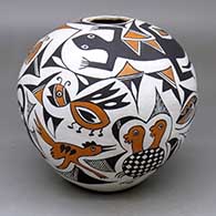 A polychrome seed pot decorated with multiple Mimbres animal, insect and geometric designs
 by Viola Gallegos of Acoma