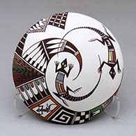 A polychrome seed pot decorated with a lizard, bird element and geometric design
 by Carolyn Concho of Acoma