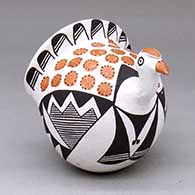 A polychrome turkey figure decorated with a fine line, bird element and geometric design
 by Lucy Lewis of Acoma
