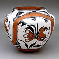 A polychrome jar decorated with a four-panel parrot, rainbow, plant and geometric design
 by Rachel Aragon of Acoma