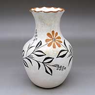 A polychrome vase with a pie crust rim and decorated with a flower, plant and geometric design
 by Unknown of Acoma