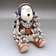 A sitting grandfather storyteller figure with 16 children
 by Mary Trujillo of Cochiti