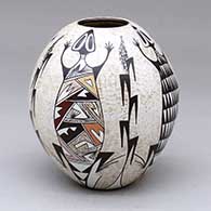 A small polychrome jar decorated with a four-panel lizard, corn stalk and geometric design
 by Sylvia Naha of Hopi