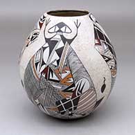 A polychrome jar decorated with a four-panel lizard, tadpole, bird element, fine line and geometric design
 by Sylvia Naha of Hopi