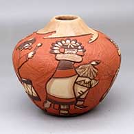A polychrome seed pot carved and painted with a design incorporating multiple dancers and geometrics
 by Elvira Nampeyo of Hopi