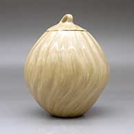 A lidded tan melon jar with 18 repousse ribs, click or tap to see a larger version