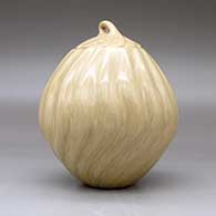 A lidded tan melon jar with 18 repousse ribs, click or tap to see a larger version