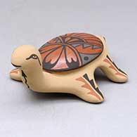 A small polychrome turtle figure decorated with a geometric design
 by Juanita Fragua of Jemez