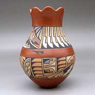 A polychrome vase with a scalloped rim and decorated with a band-of-feathers and geometric design, click or tap to see a larger version