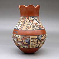 A polychrome vase with a scalloped rim and decorated with a band-of-feathers and geometric design, click or tap to see a larger version