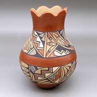 A polychrome vase with a scalloped rim and decorated with a band-of-feathers and geometric design
 by Helen Shendo of Jemez
