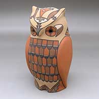 A polychrome Jemez owl figure decorated with a bird element and geometric design
 by Persingula Gachupin of Jemez