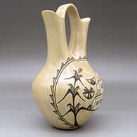 A black-on-tan wedding vase decorated on one side with a pueblo, cornstalk and geometric design, click or tap to see a larger version